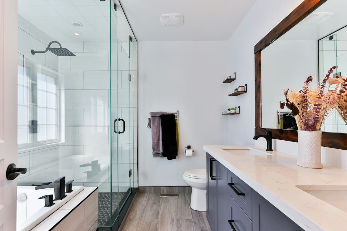 Clean, freshly detailed coastal bathroom with polished hardware and stone vanity